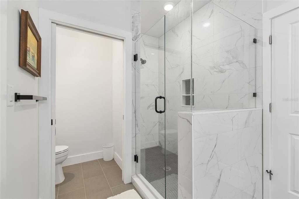 2601 Southwest Williston Road, Unit 106 Gainesville, FL 32608 - Photo 57 of 82 a bathroom with a shower and a toilet