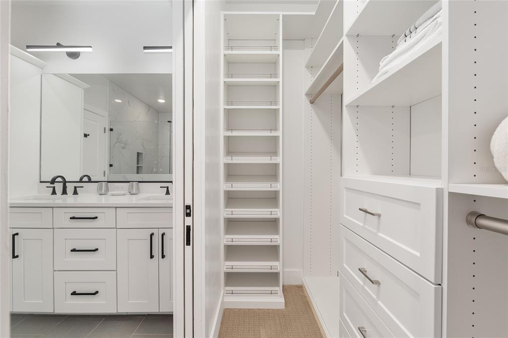 2601 Southwest Williston Road, Unit 106 Gainesville, FL 32608 - Photo 61 of 82 a bathroom with a sink vanity and a mirror
