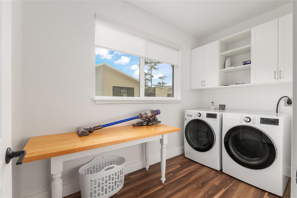2601 Southwest Williston Road, Unit 106 Gainesville, FL 32608 - Photo 68 of 82 a utility room with sink dryer and washer
