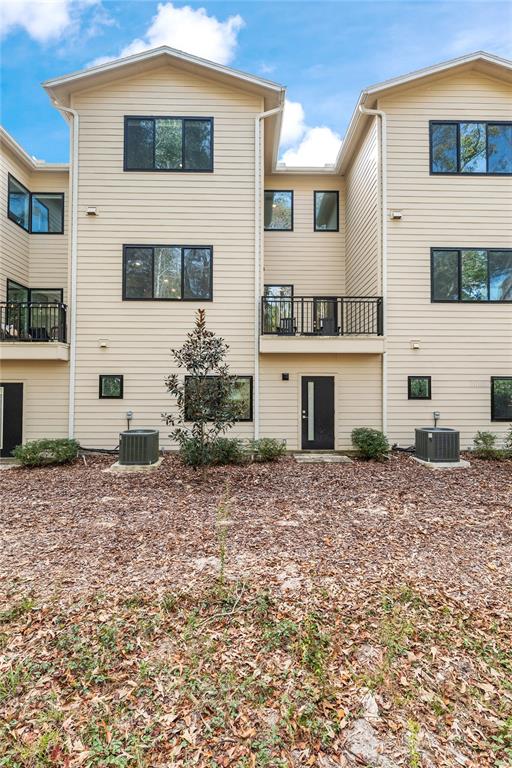 2601 Southwest Williston Road, Unit 106 Gainesville, FL 32608 - Photo 78 of 82 a front view of a house with a yard