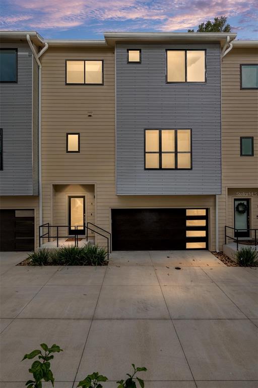 2601 Southwest Williston Road, Unit 106 Gainesville, FL 32608 - Photo 81 of 82 a front view of a house with a yard