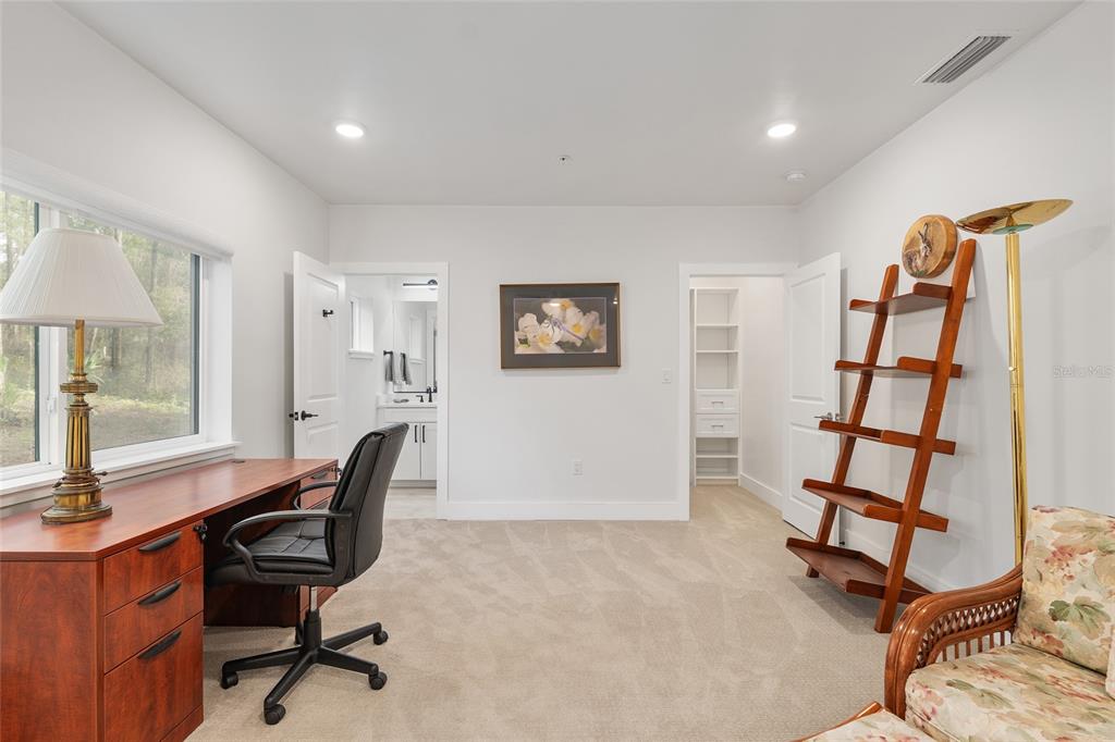 2601 Southwest Williston Road, Unit 106 Gainesville, FL 32608 - Photo 10 of 82 a view of a workspace with furniture and a window