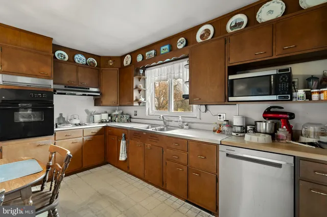 a bed room with a bed and a book shelf