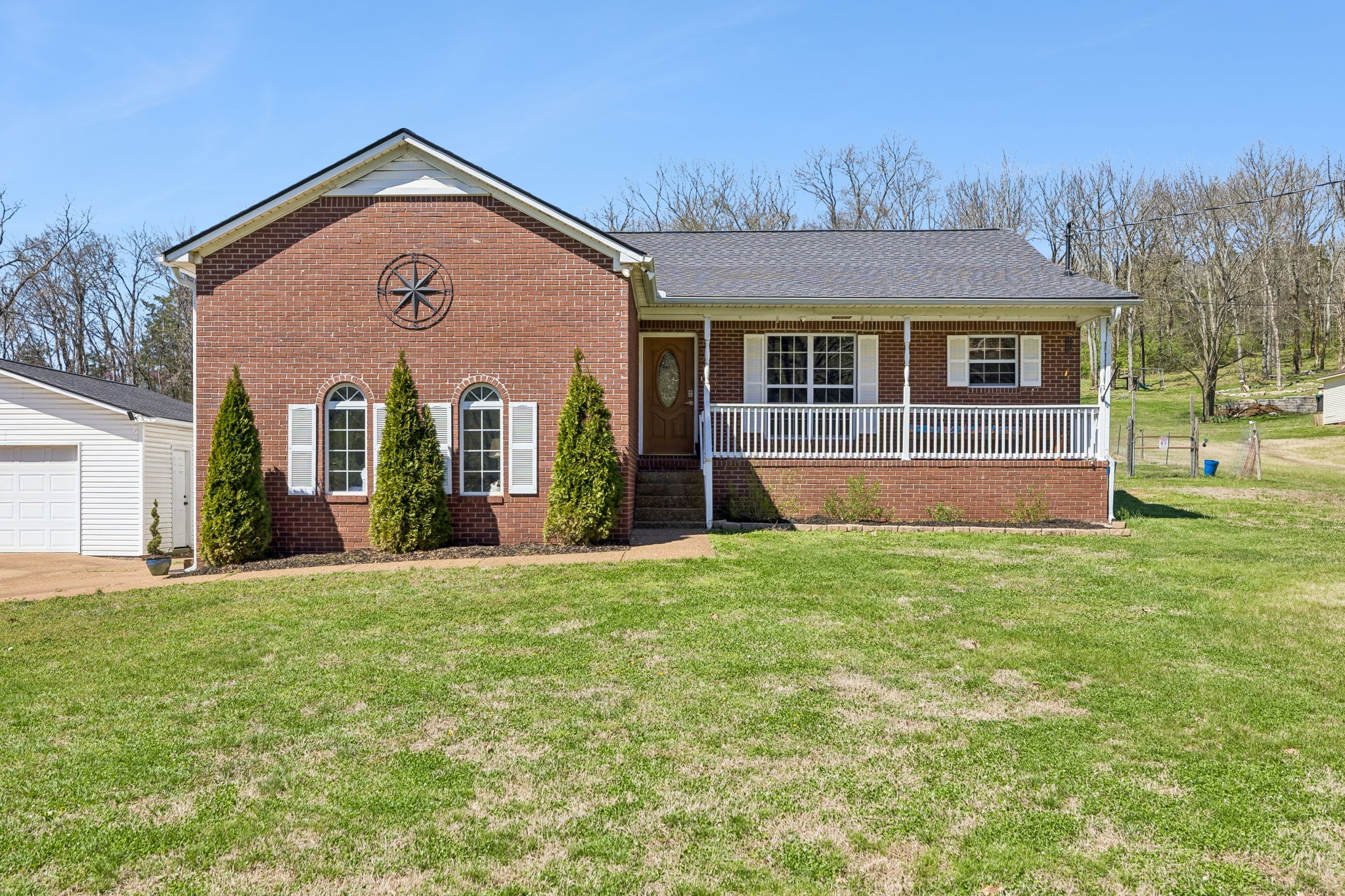 1245 Cliff Amos Road Spring Hill, TN 37174 - Photo 1 of 41 front view of a house with a yard