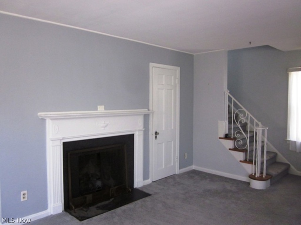 2390 Queenston Road Cleveland, OH 44118 - Photo 3 of 17 Living Room with Fireplace ~ Hardwood Floors under carpet.