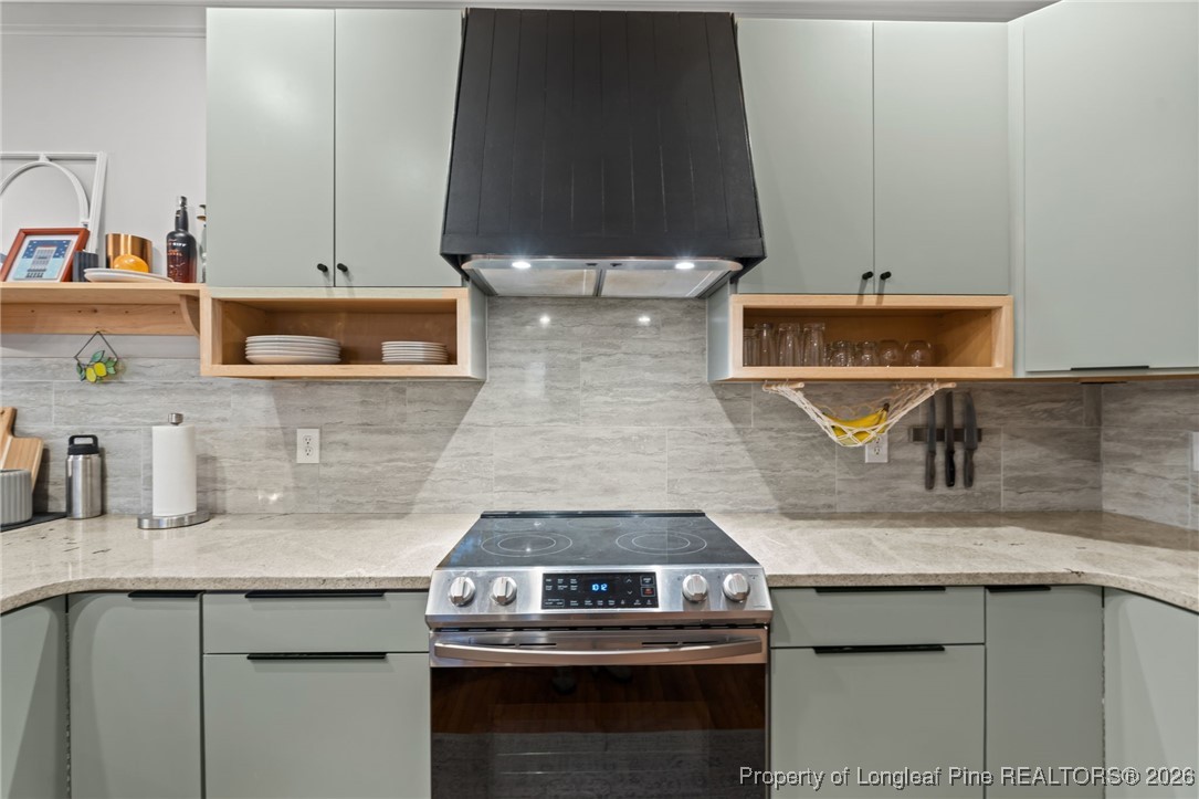 16 Cottswold Lane Spring Lake, NC 28390 - Photo 8 of 49 a kitchen with a stove and a sink