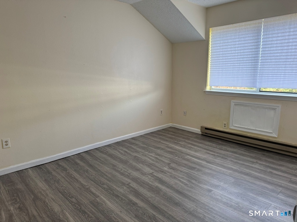 925 Oronoke Road, Unit 30L Waterbury, CT 06708 - Photo 15 of 21 a view of a room with wooden floor and a window