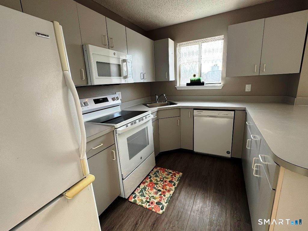 925 Oronoke Road, Unit 30L Waterbury, CT 06708 - Photo 8 of 21 a kitchen with cabinets appliances and a window