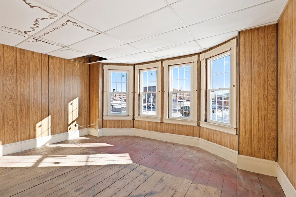 5 Temple Street Lawrence, MA 01843 - Photo 12 of 17 a view of an empty room with a fireplace and a window