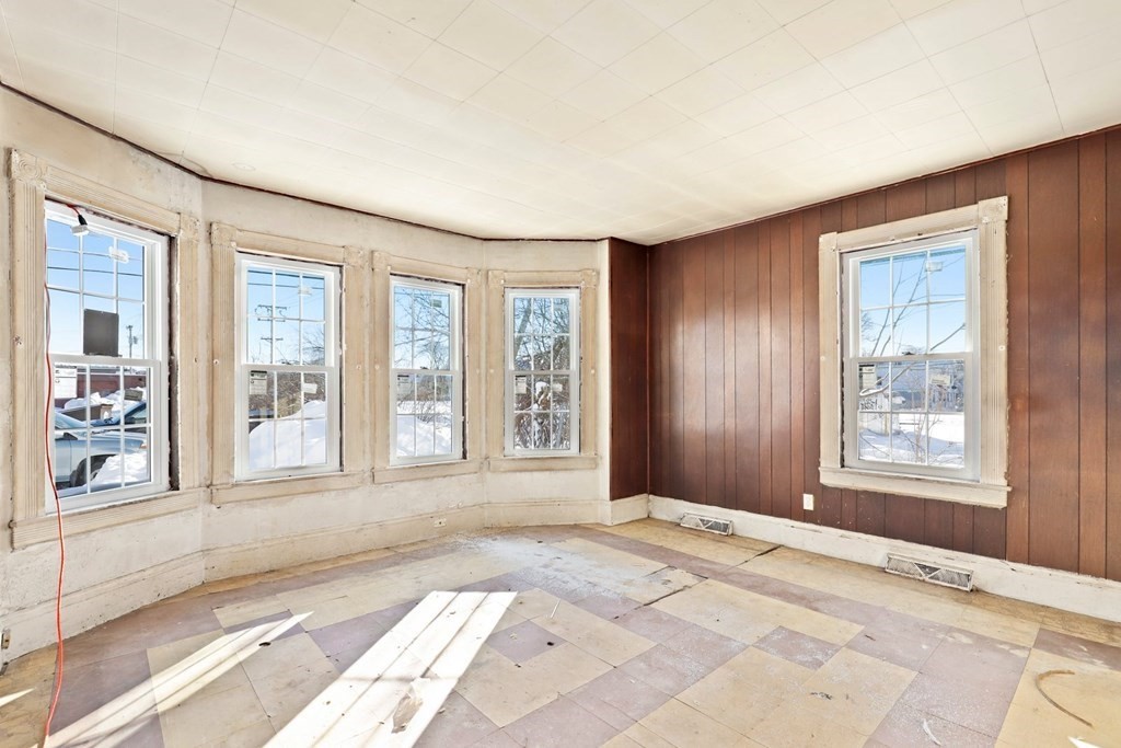 5 Temple Street Lawrence, MA 01843 - Photo 15 of 17 a bedroom with a large bed and a large window