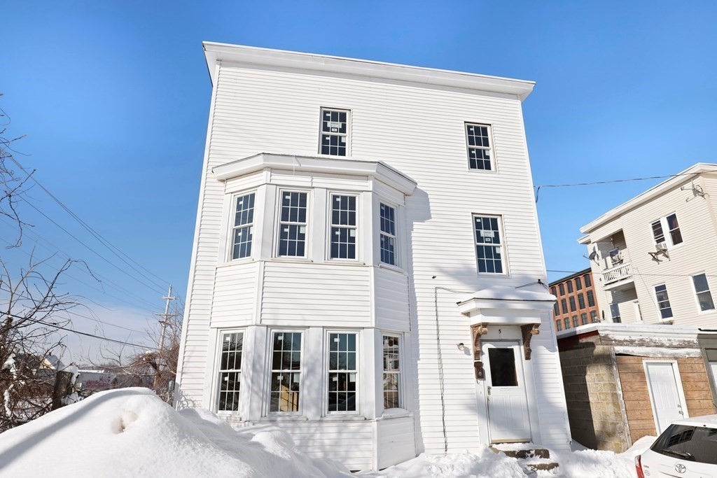 5 Temple Street Lawrence, MA 01843 - Photo 8 of 17 a front view of a building with a lot of windows