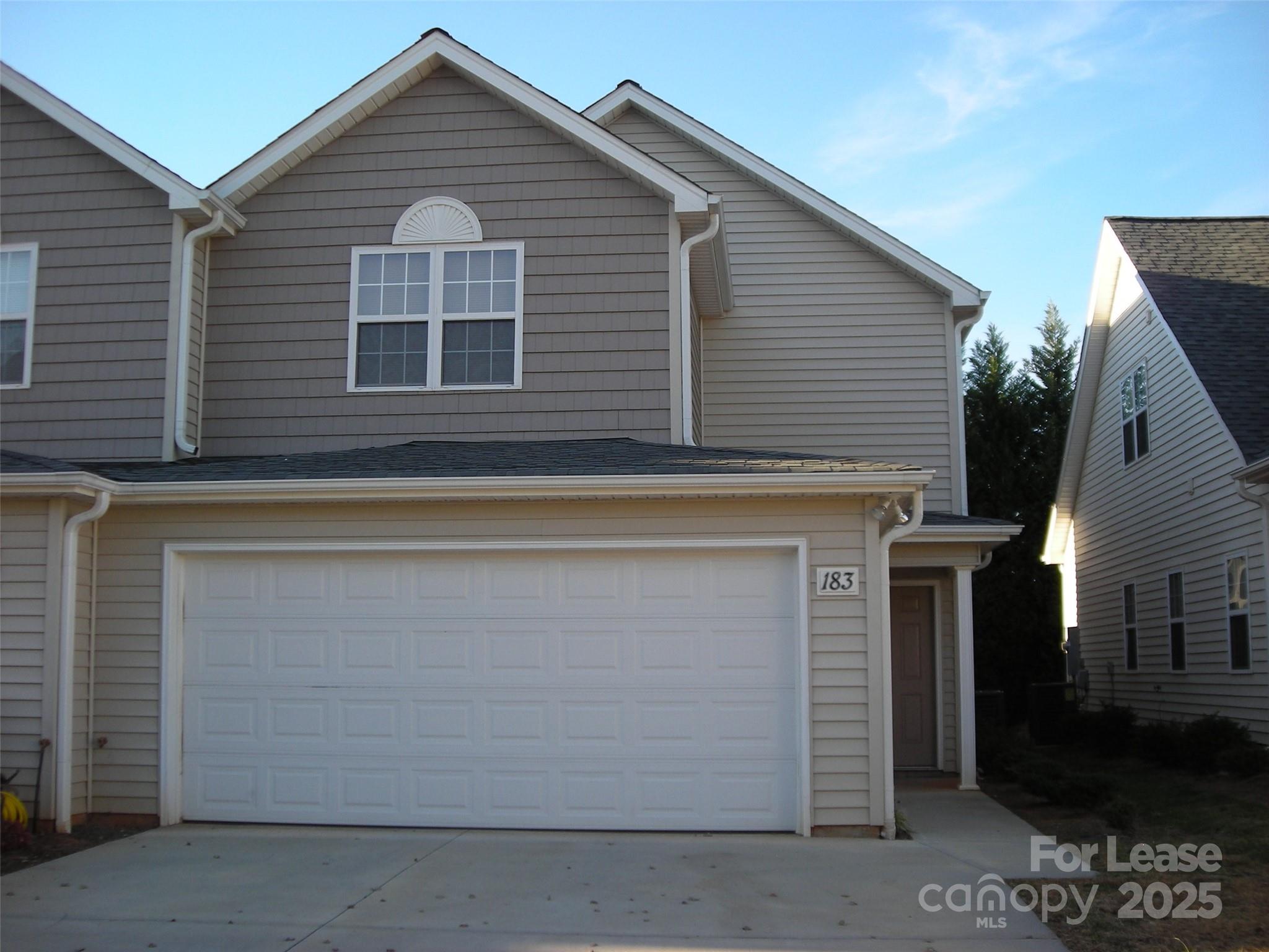 a view of a house with a garage