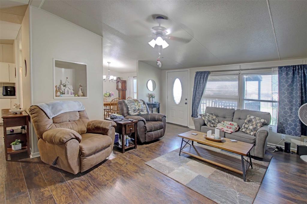 2004 Fall Creek Road Cleburne, TX 76033 - Photo 4 of 18 a living room with furniture and a large window or couch