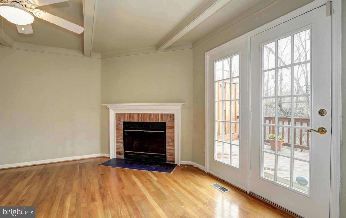 10922 Brewer House Road Rockville, MD 20852 - Photo 6 of 24 Wood Burning Fireplace. Access to Deck.