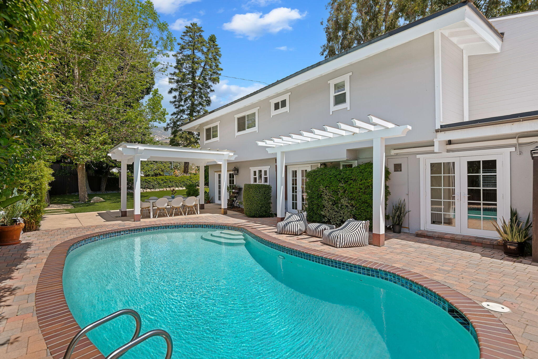 809 Willowglen Road Santa Barbara, CA 93105 - Photo 26 of 50 a view of a house with swimming pool and sitting area