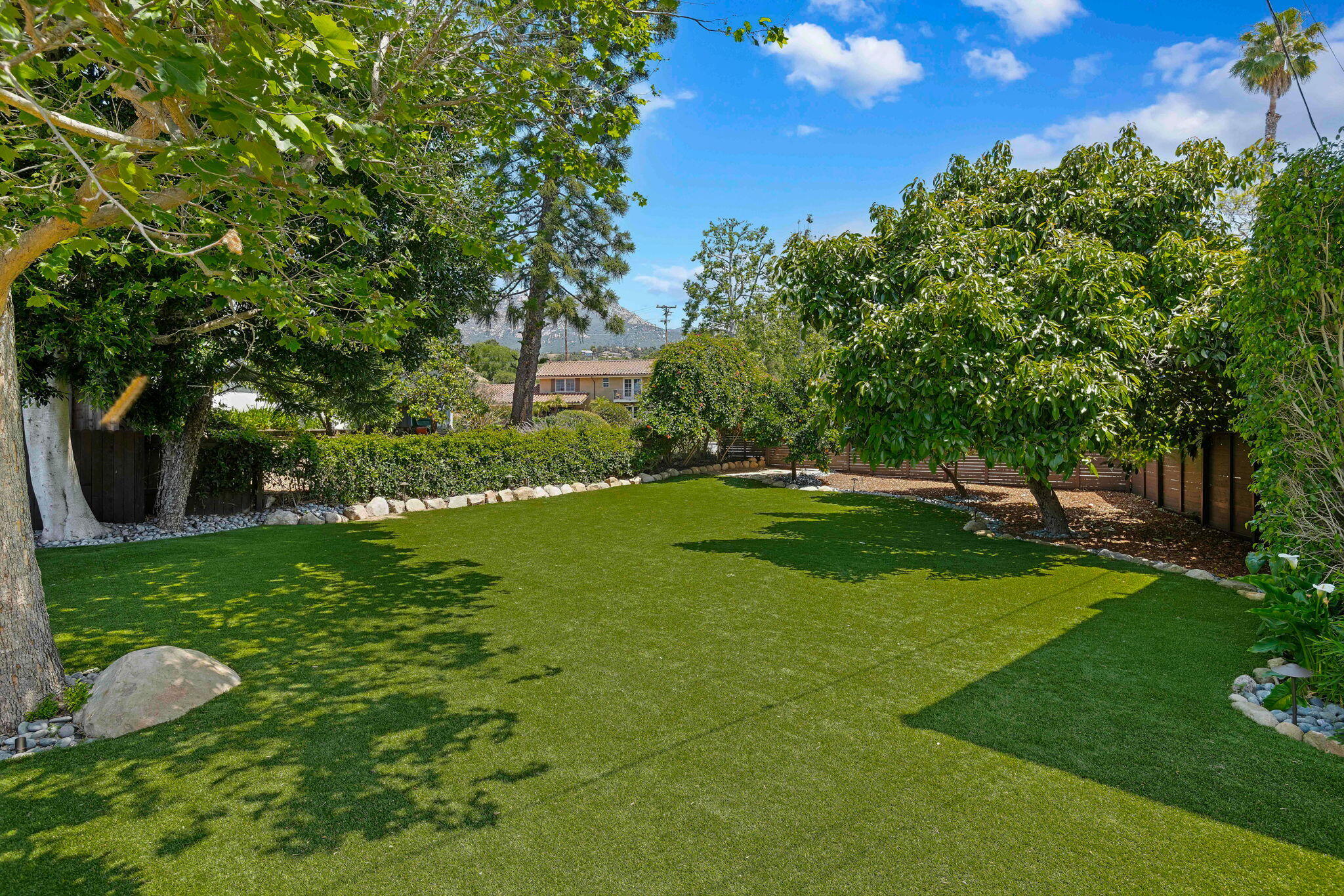 809 Willowglen Road Santa Barbara, CA 93105 - Photo 28 of 50 a backyard of a house with lots of green space