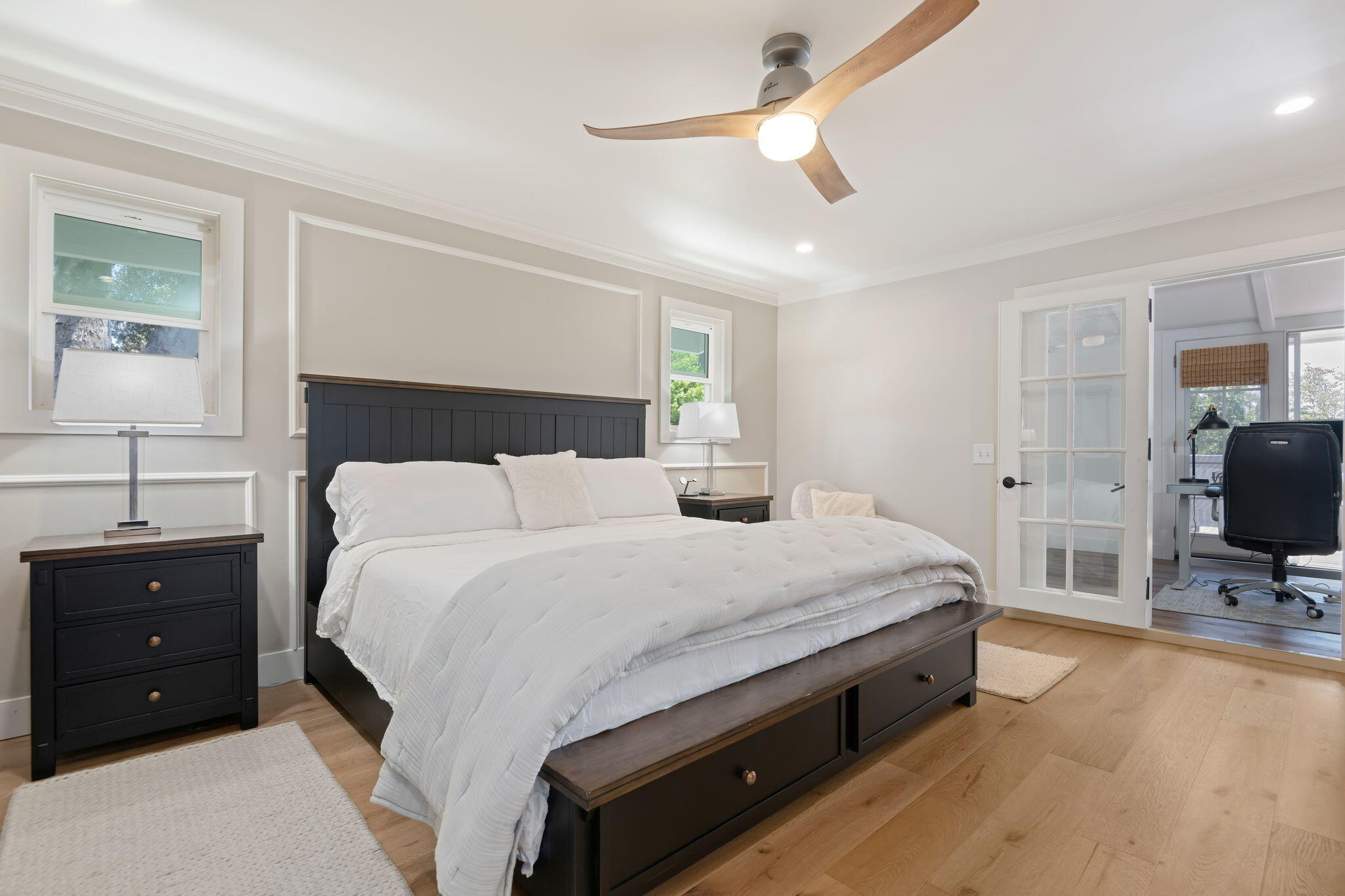 809 Willowglen Road Santa Barbara, CA 93105 - Photo 31 of 50 a spacious bedroom with a bed and a flat screen tv