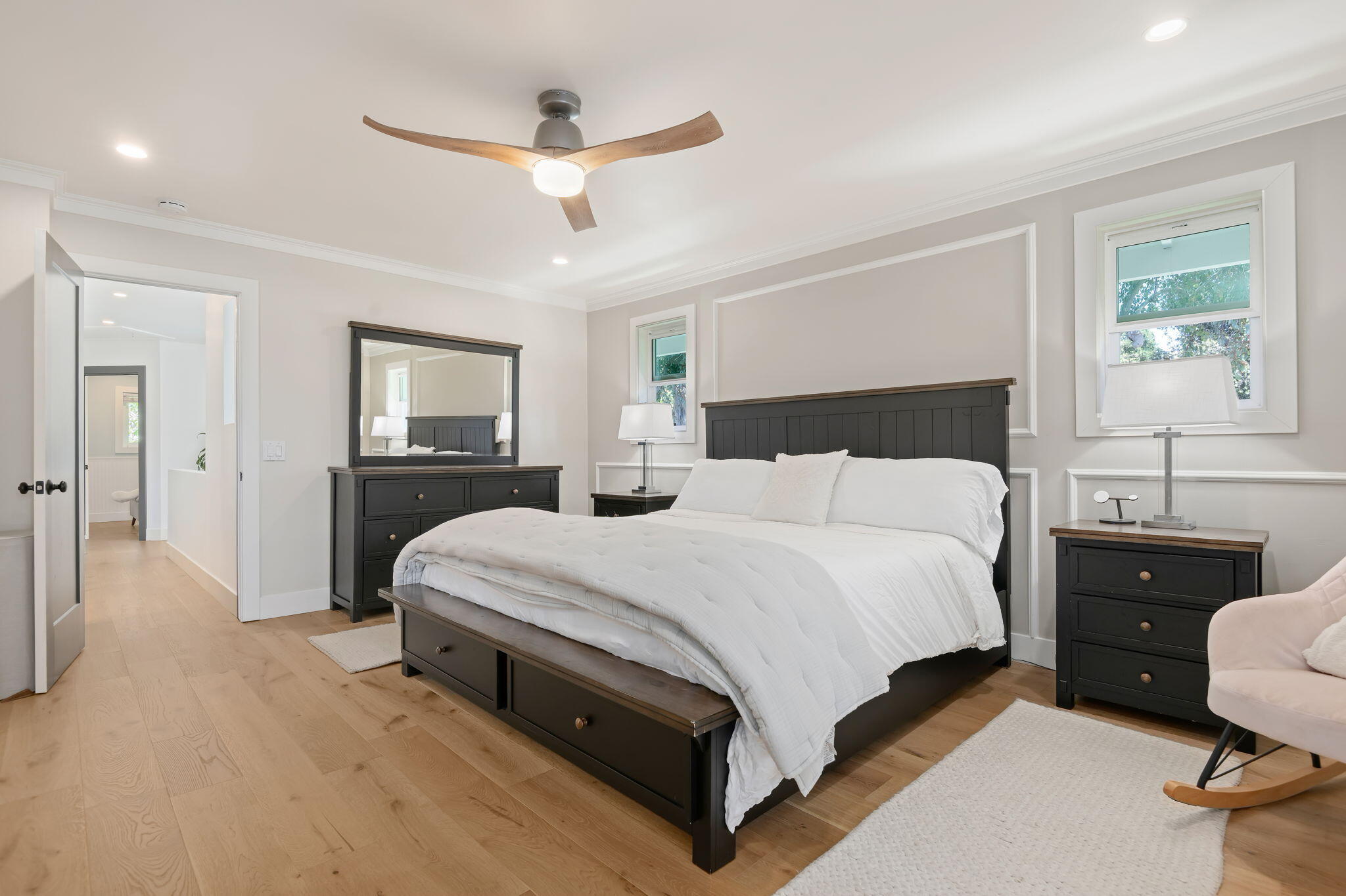 809 Willowglen Road Santa Barbara, CA 93105 - Photo 32 of 50 a bedroom with a bed and a chandelier