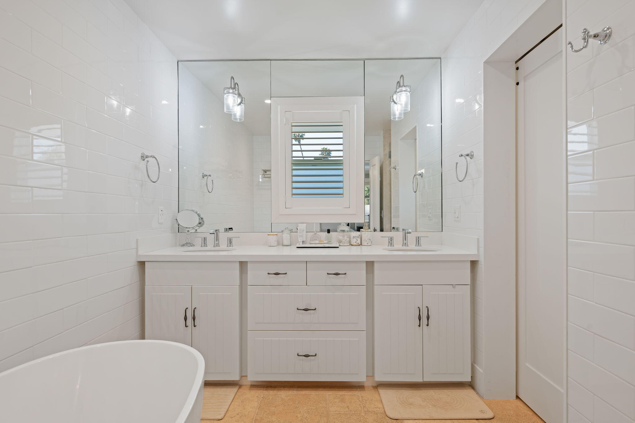 809 Willowglen Road Santa Barbara, CA 93105 - Photo 33 of 50 a bathroom with a double vanity sink a mirror and a bathtub