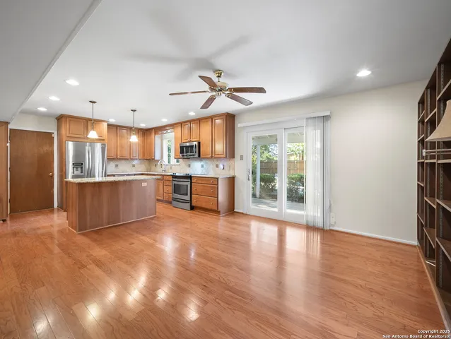 a view of a kitchen with a stove cabinets and a kitchen