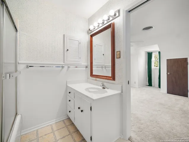 a bathroom with a sink and a mirror
