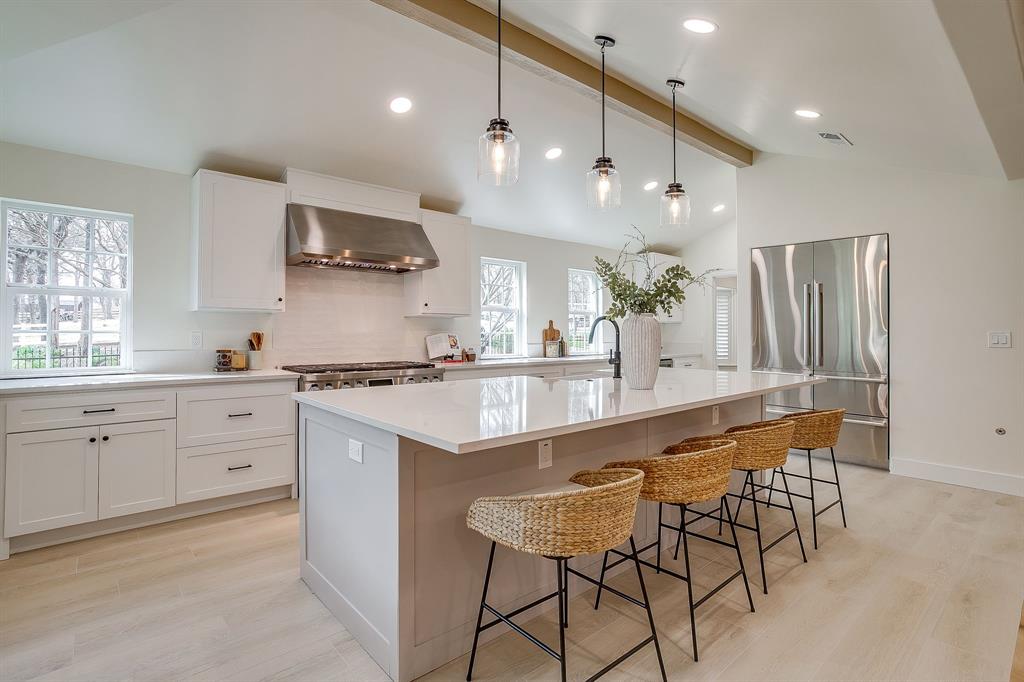 1432 Mount Gilead Road Keller, TX 76262 - Photo 12 of 40 a large kitchen with stainless steel appliances kitchen island granite countertop a sink and cabinets