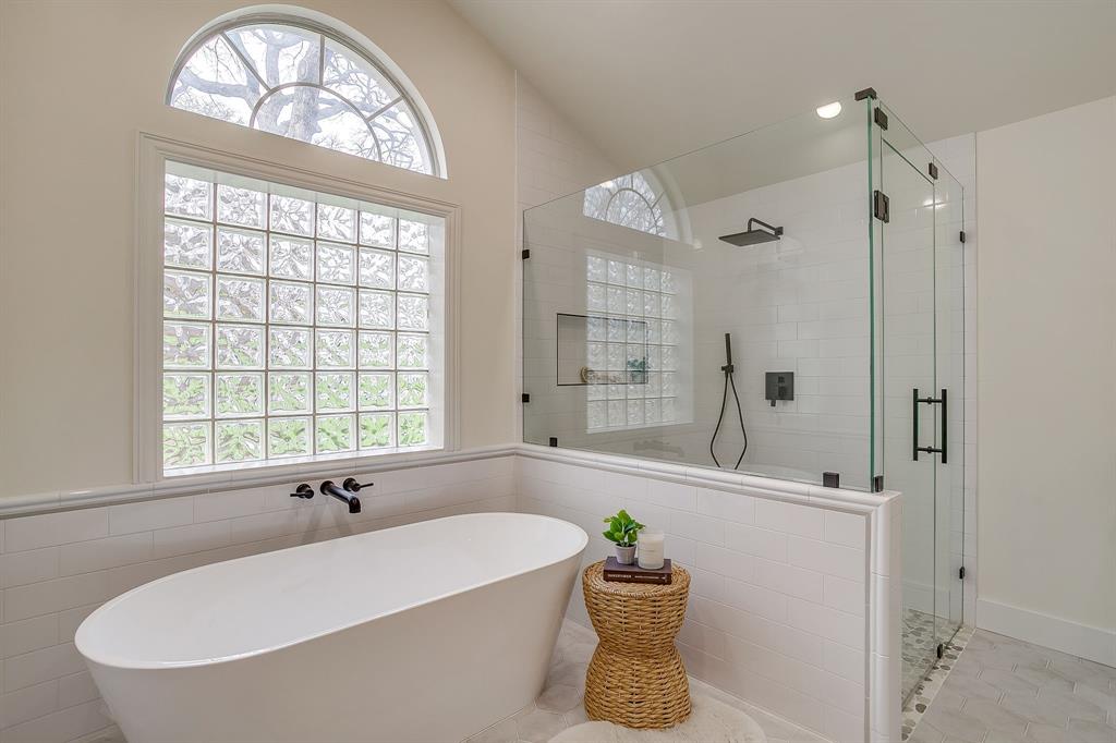 1432 Mount Gilead Road Keller, TX 76262 - Photo 20 of 40 a bathroom with a tub a sink and a window