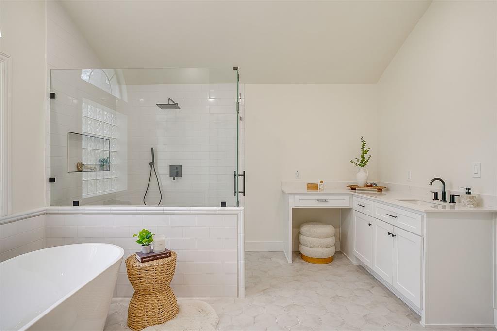 1432 Mount Gilead Road Keller, TX 76262 - Photo 21 of 40 a bathroom with a bathtub sink and mirror