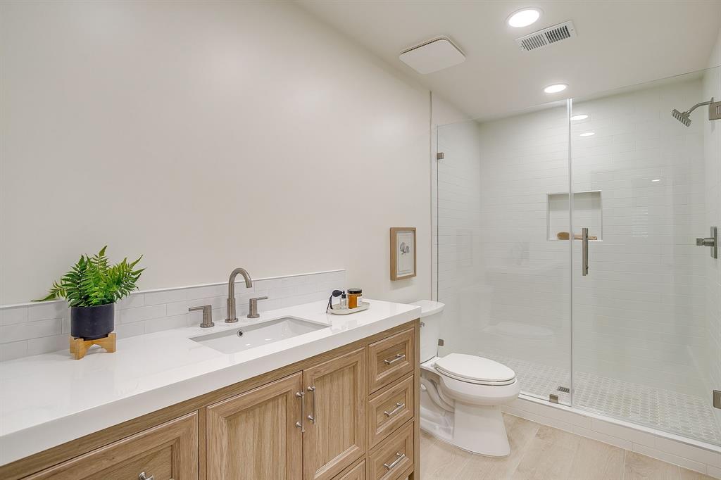 1432 Mount Gilead Road Keller, TX 76262 - Photo 24 of 40 a bathroom with a sink a toilet and shower
