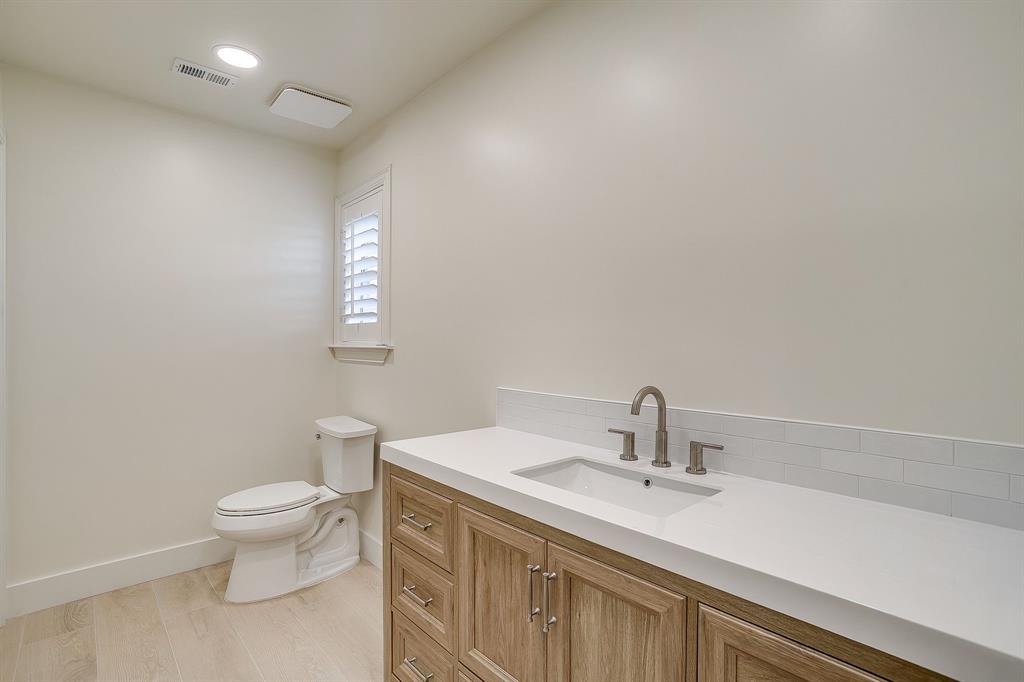 1432 Mount Gilead Road Keller, TX 76262 - Photo 26 of 40 a bathroom with a sink a toilet and a mirror