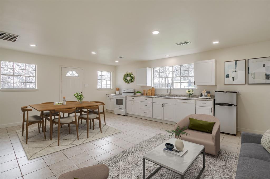 1432 Mount Gilead Road Keller, TX 76262 - Photo 34 of 40 a kitchen with a dining table chairs and view of living room