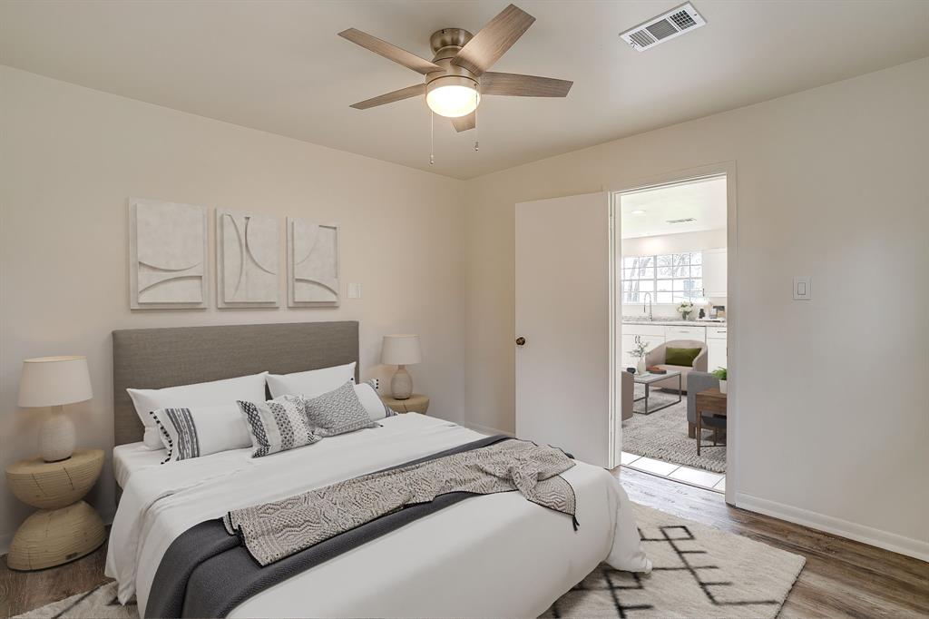 1432 Mount Gilead Road Keller, TX 76262 - Photo 36 of 40 a bedroom with a bed and a chandelier