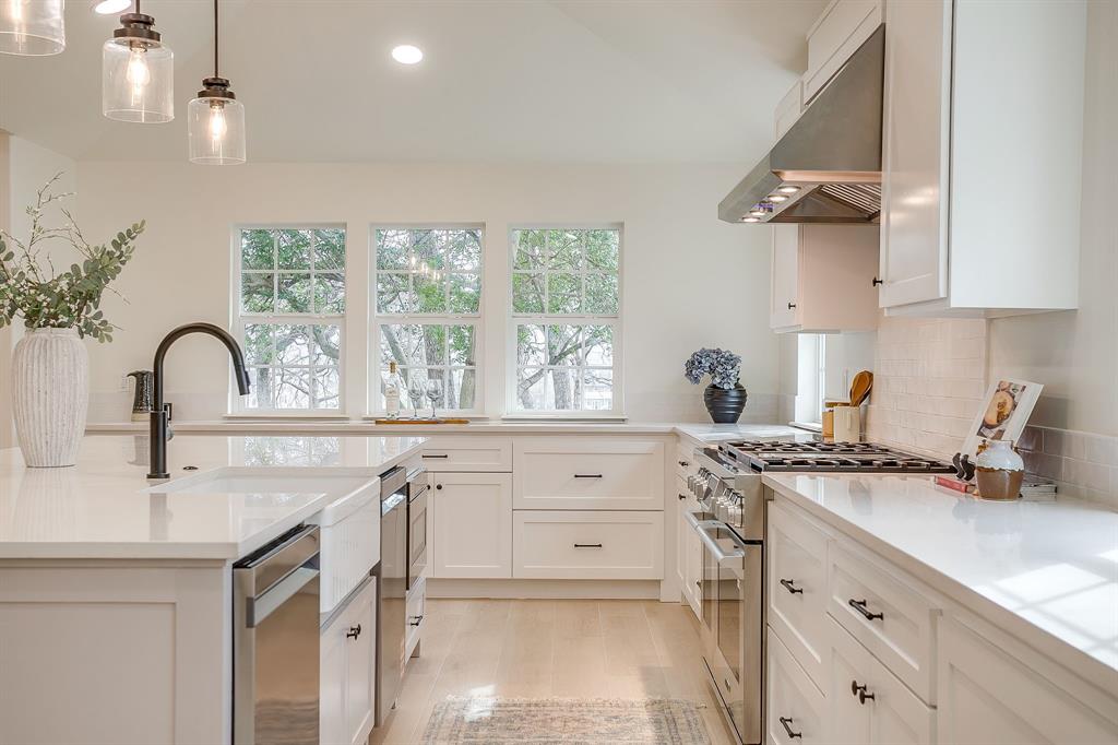 1432 Mount Gilead Road Keller, TX 76262 - Photo 10 of 40 a kitchen with a sink stove and cabinets