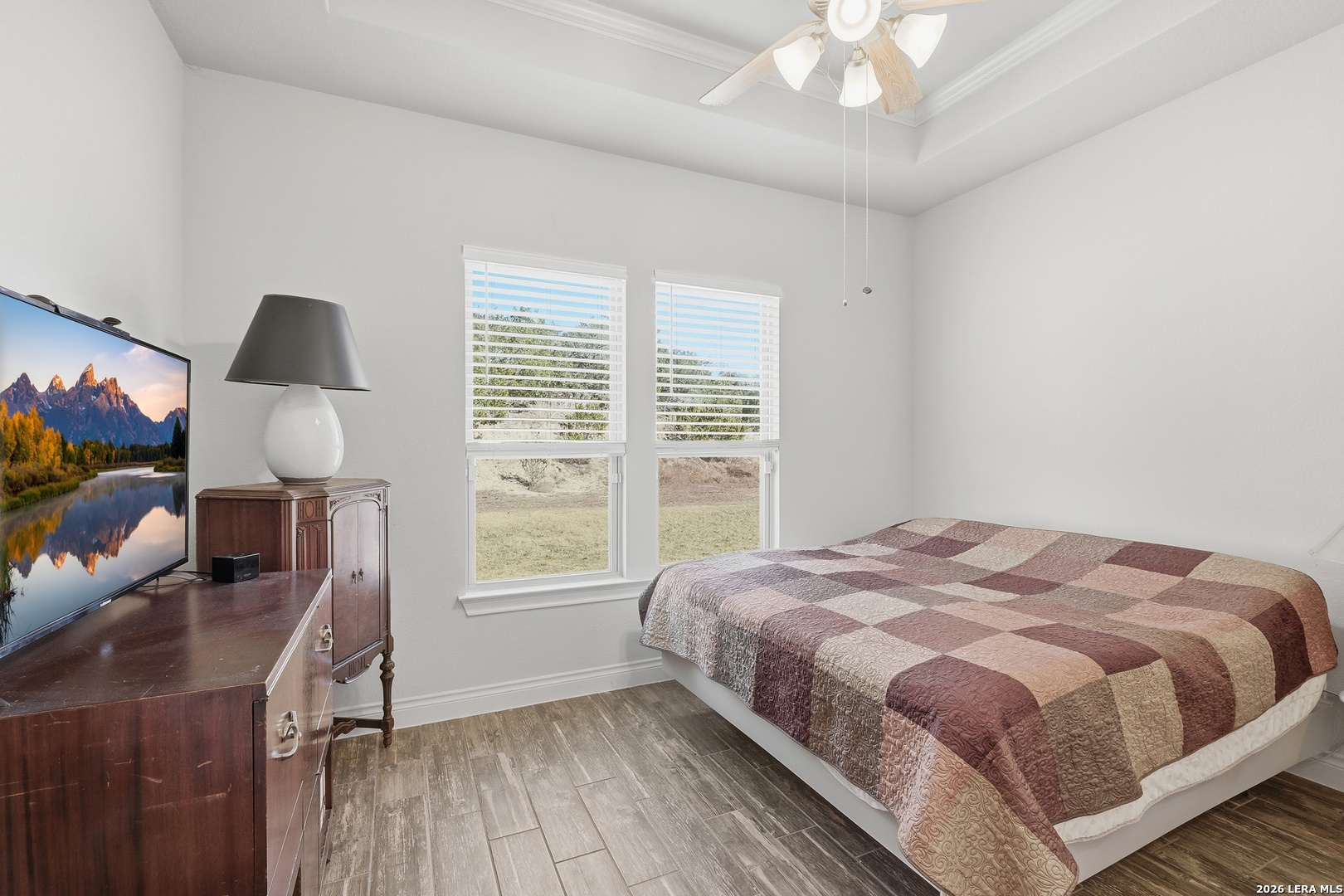 224 Mystic Shores Boulevard Spring Branch, TX 78070 - Photo 12 of 30 a bedroom with a bed tv and a window