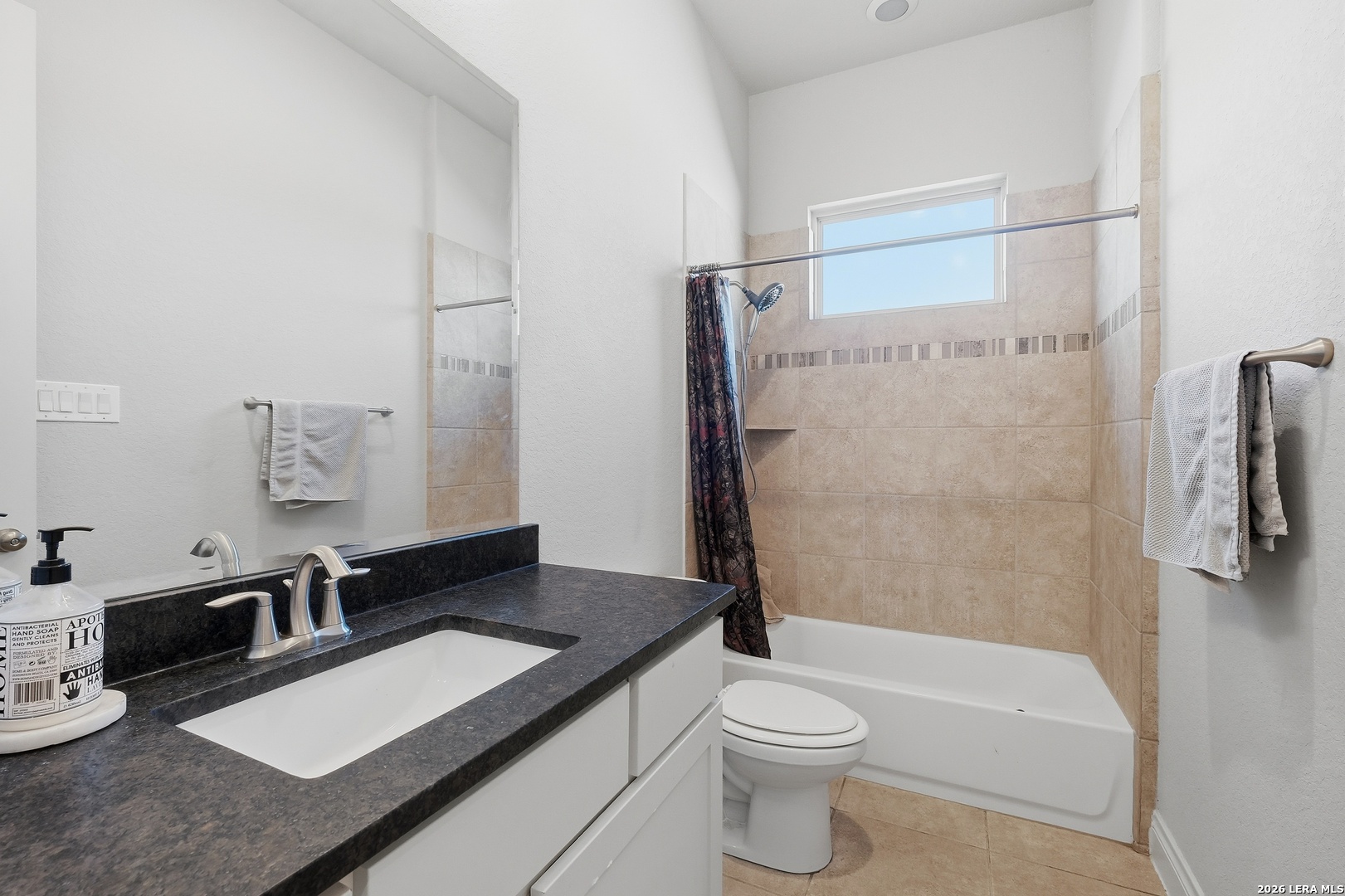 224 Mystic Shores Boulevard Spring Branch, TX 78070 - Photo 16 of 30 a bathroom with a sink a toilet and a tub