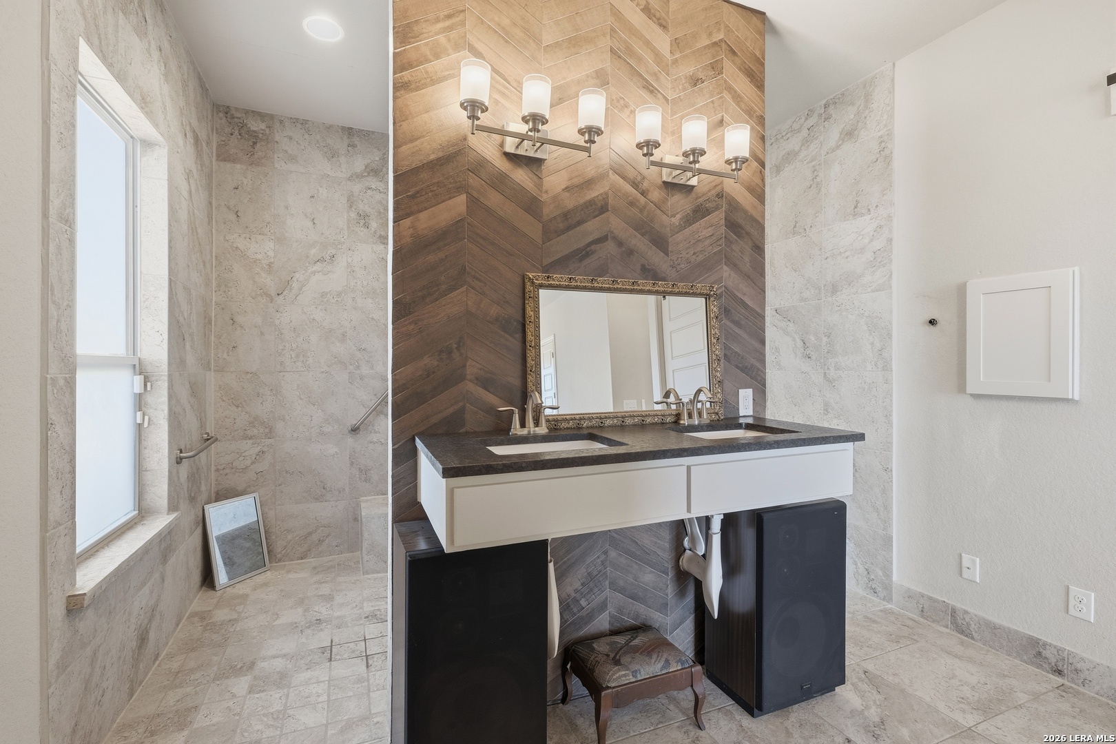 224 Mystic Shores Boulevard Spring Branch, TX 78070 - Photo 20 of 30 a bathroom with a sink a mirror and a shower