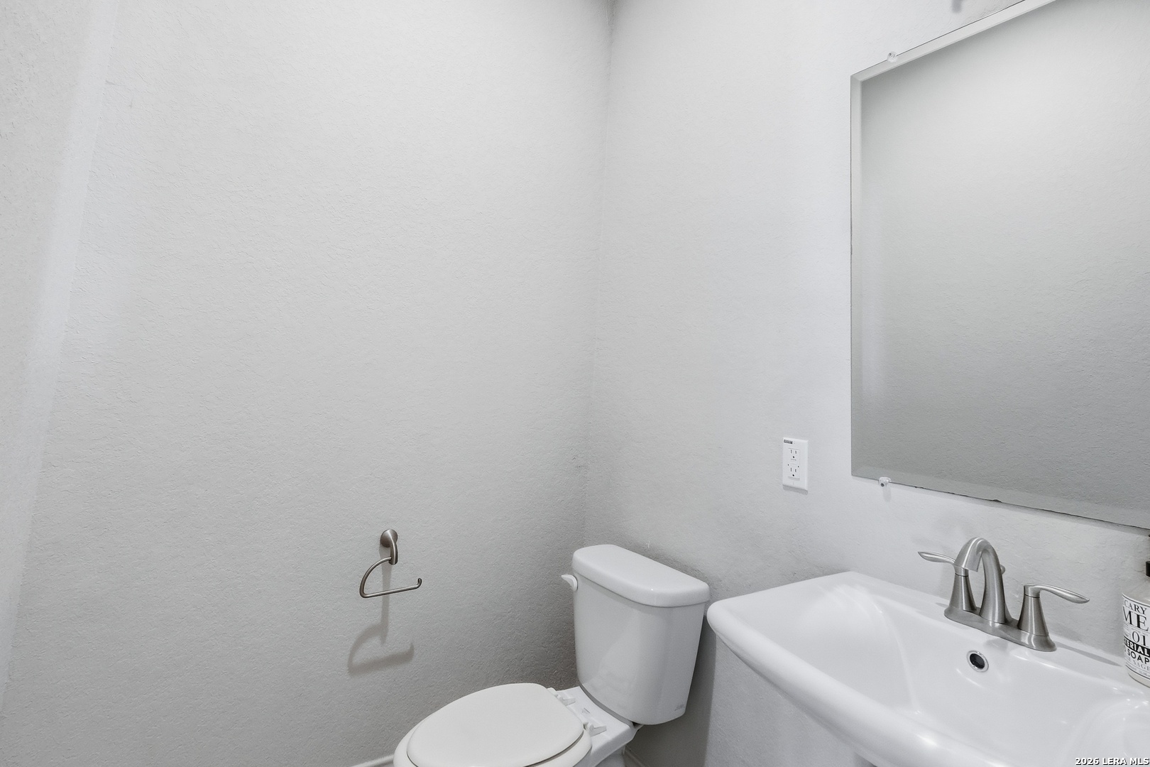 224 Mystic Shores Boulevard Spring Branch, TX 78070 - Photo 21 of 30 a white toilet sitting next to a white sink
