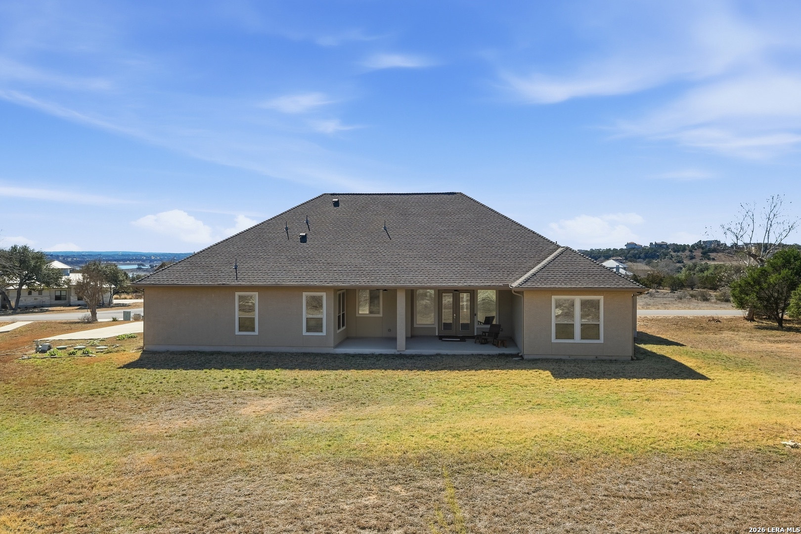 224 Mystic Shores Boulevard Spring Branch, TX 78070 - Photo 26 of 30 a front view of a house with a yard