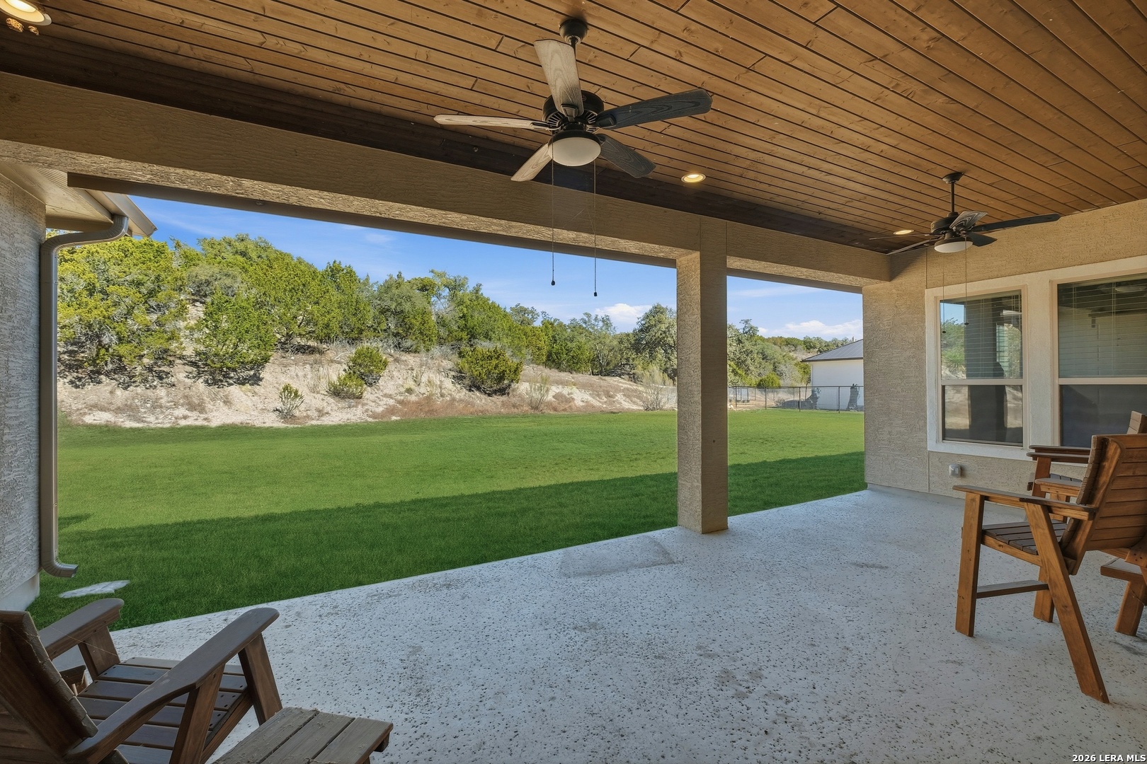 224 Mystic Shores Boulevard Spring Branch, TX 78070 - Photo 28 of 30 a view of a porch with furniture and garden