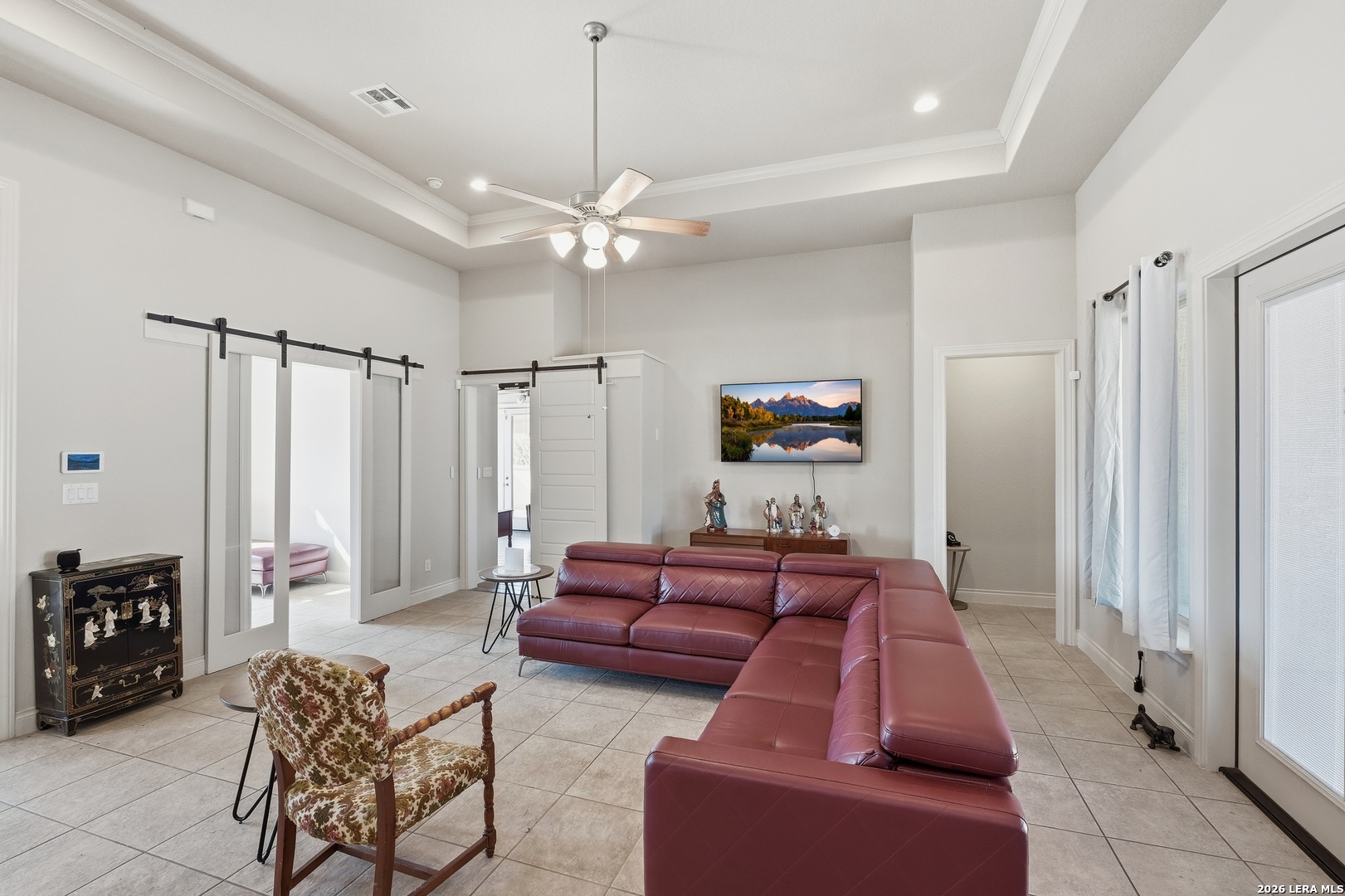 224 Mystic Shores Boulevard Spring Branch, TX 78070 - Photo 4 of 30 a living room with furniture and a chandelier
