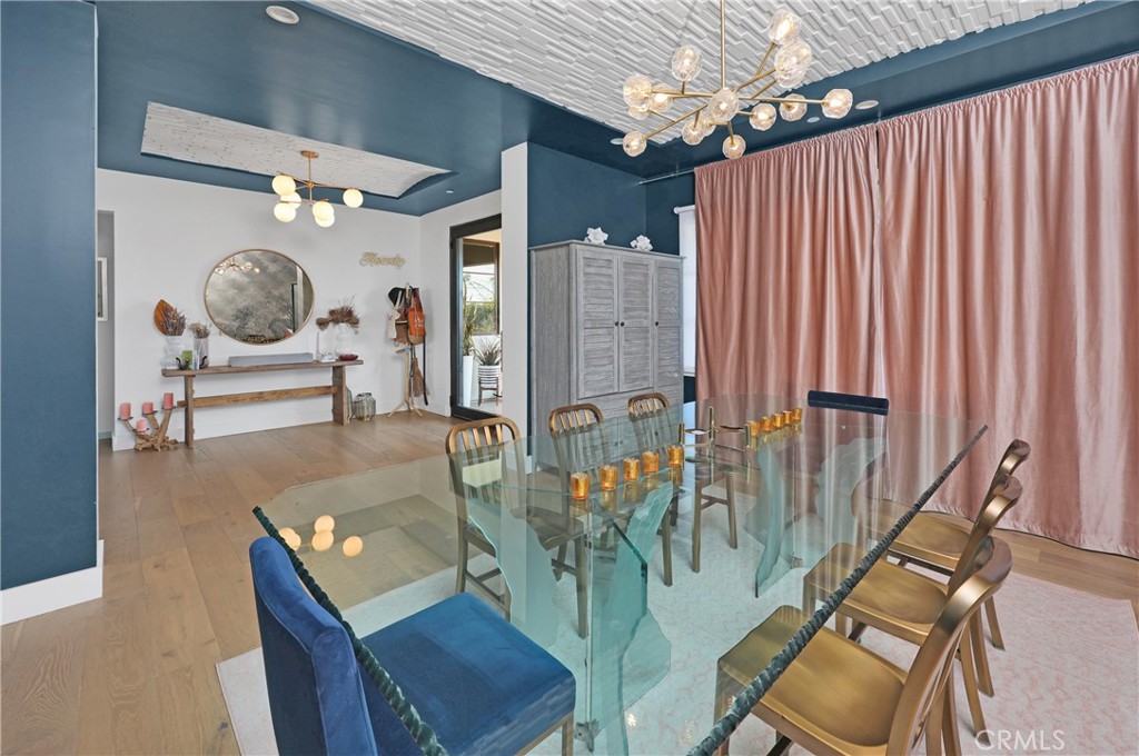 16582 Rio Vista Road San Diego, CA 92127 - Photo 11 of 49 a living room with furniture and a chandelier