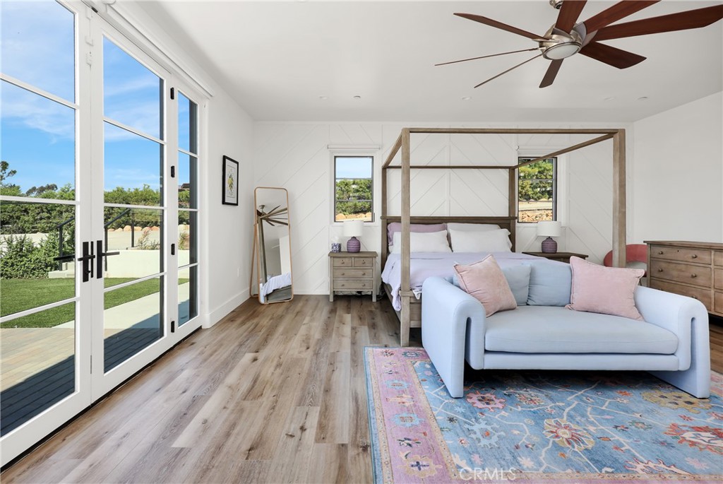 16582 Rio Vista Road San Diego, CA 92127 - Photo 16 of 49 a living room with furniture and a large window