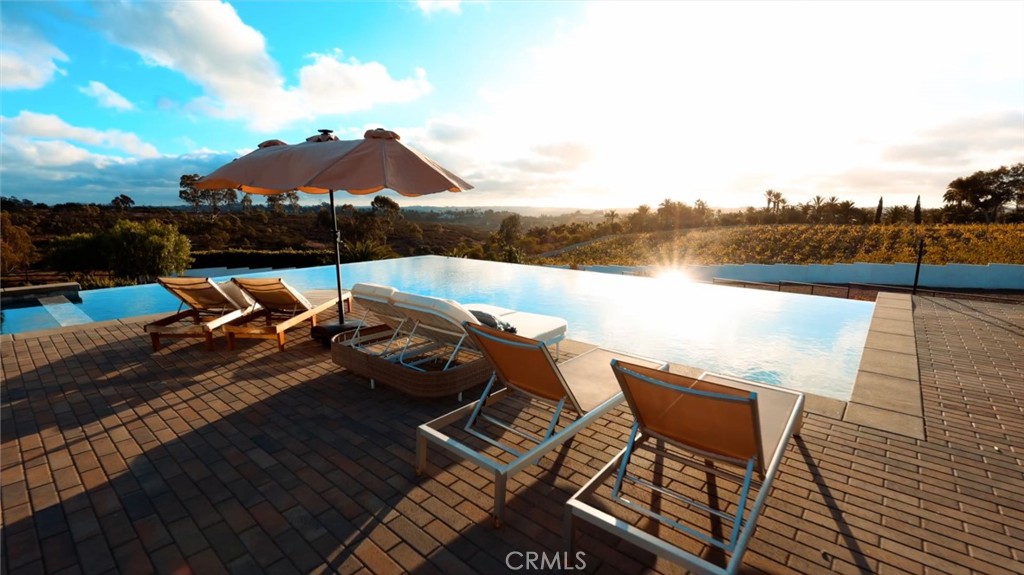 16582 Rio Vista Road San Diego, CA 92127 - Photo 2 of 49 a view of a terrace with chairs