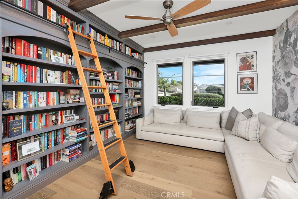 16582 Rio Vista Road San Diego, CA 92127 - Photo 28 of 49 a living room with furniture and a book shelf