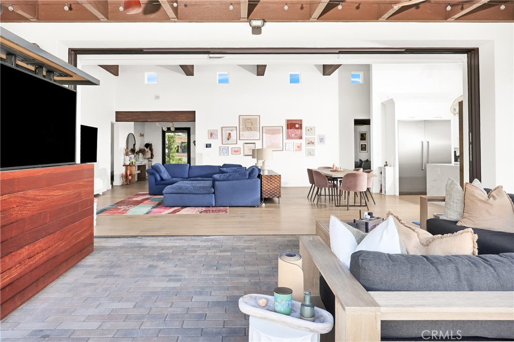 16582 Rio Vista Road San Diego, CA 92127 - Photo 33 of 49 a living room with furniture and a flat screen tv