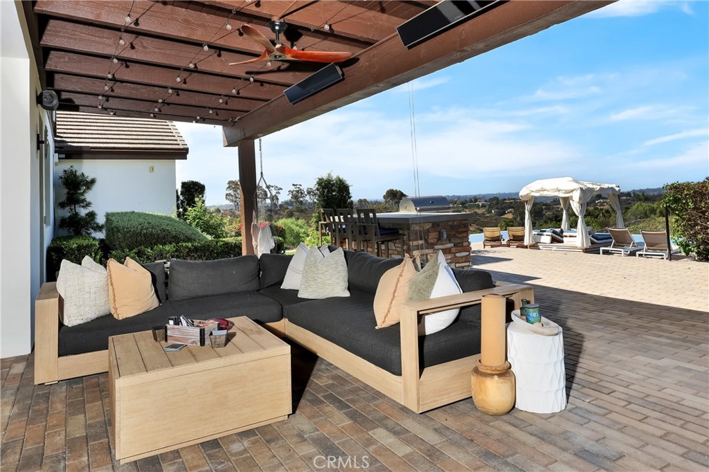 16582 Rio Vista Road San Diego, CA 92127 - Photo 34 of 49 a roof deck with couches and potted plants