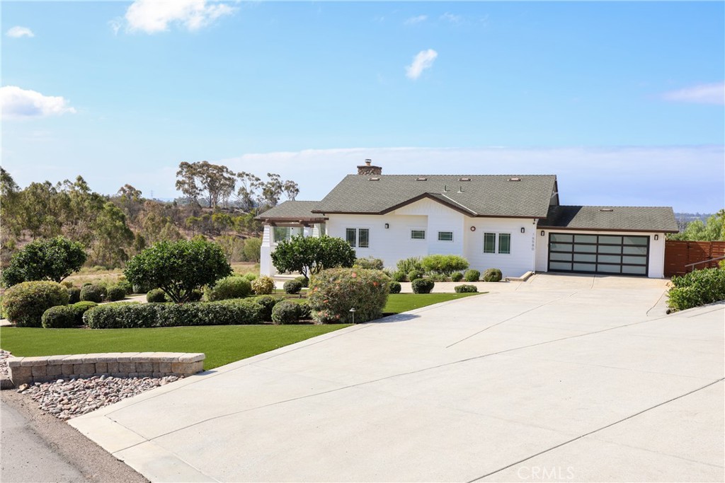16582 Rio Vista Road San Diego, CA 92127 - Photo 40 of 49 an aerial view of a house with a yard and potted plants