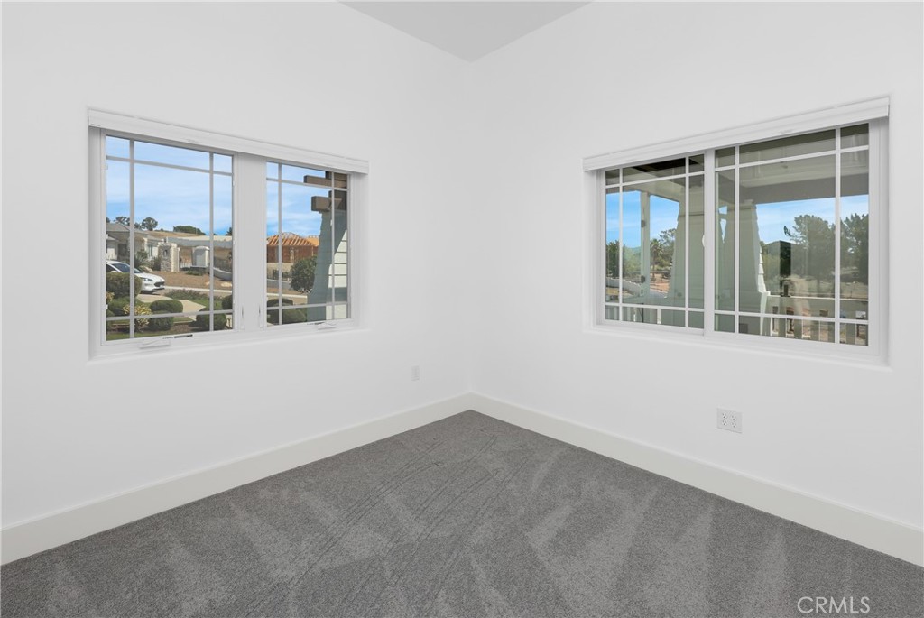 16582 Rio Vista Road San Diego, CA 92127 - Photo 43 of 49 an empty room with windows
