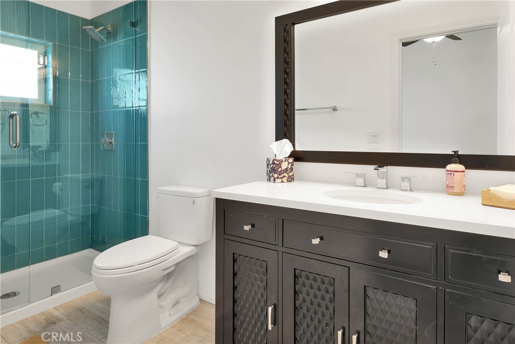 16582 Rio Vista Road San Diego, CA 92127 - Photo 45 of 49 a bathroom with a sink a toilet and shower