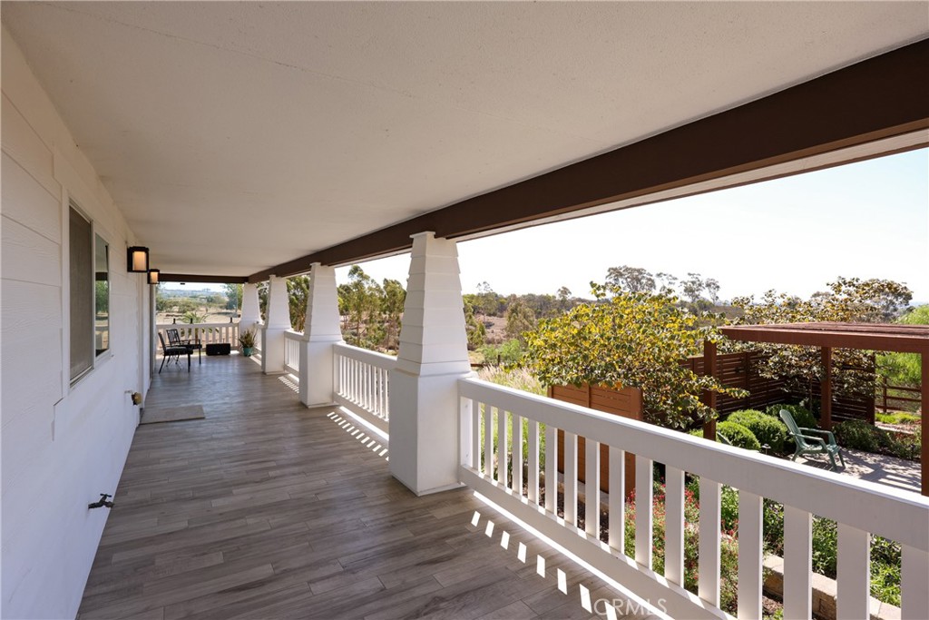 16582 Rio Vista Road San Diego, CA 92127 - Photo 46 of 49 a view of a porch with wooden floor and outdoor space